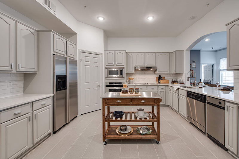 Spacious kitchen with island and luxe appliances - Alto at Highland Park